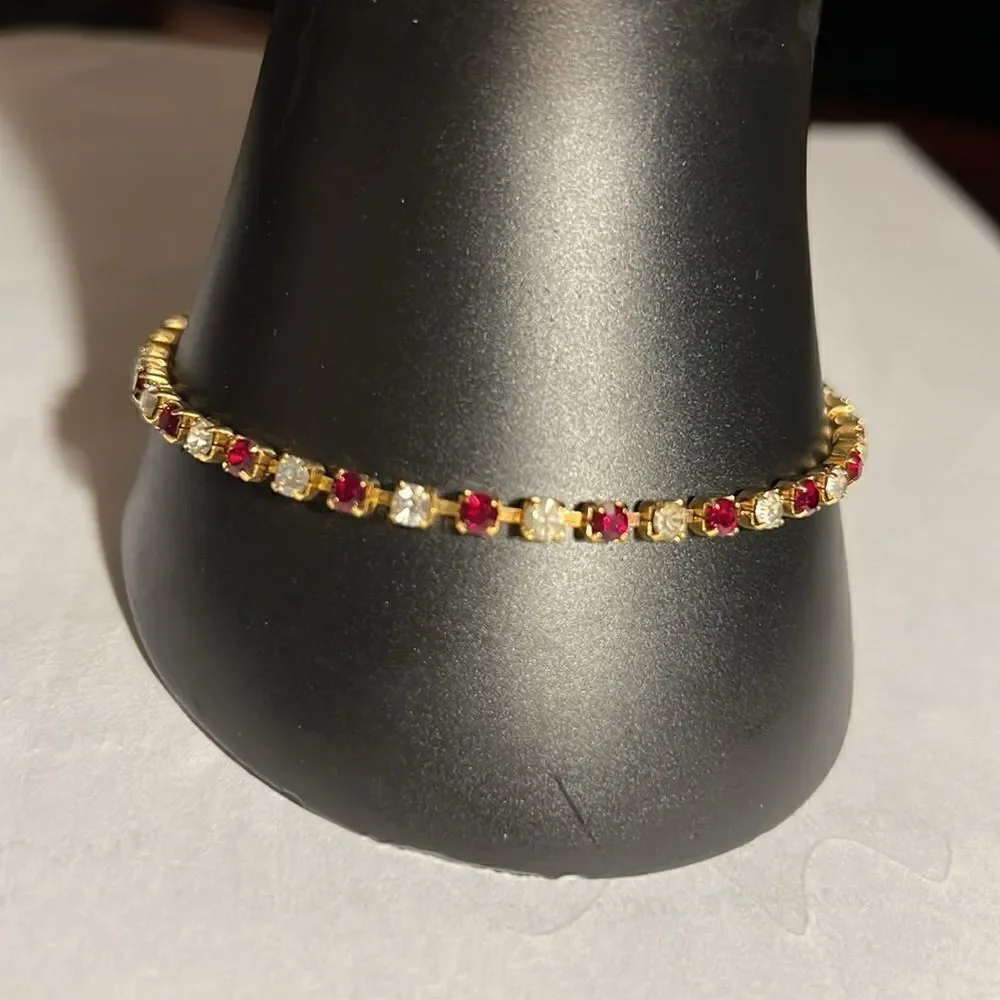 Ladies 8” faux Ruby/Diamond tennis bracelet.